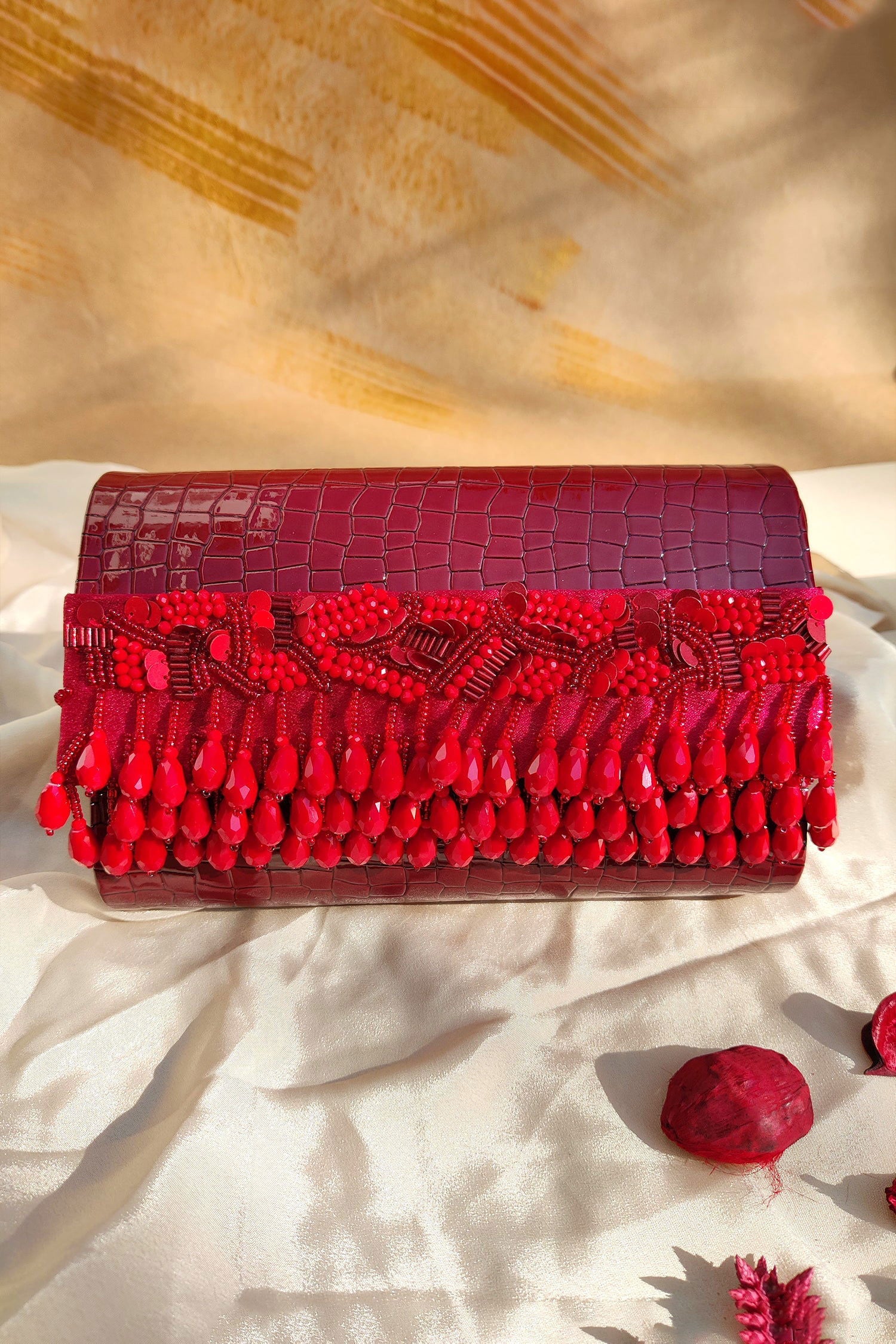 NOORIE RED HANDHELD CLUTCH - www.Shopthatapp.com