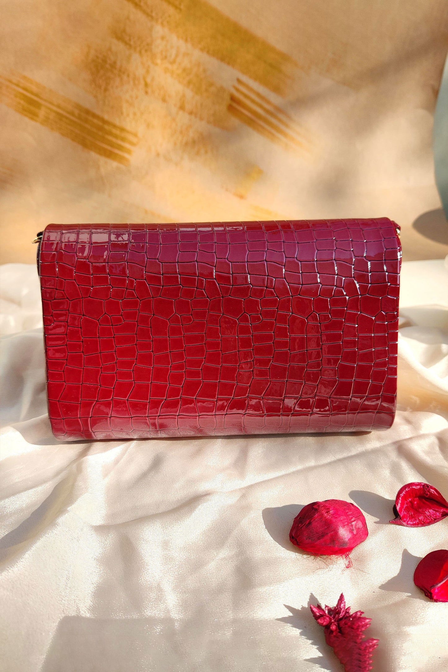 NOORIE RED HANDHELD CLUTCH - www.Shopthatapp.com