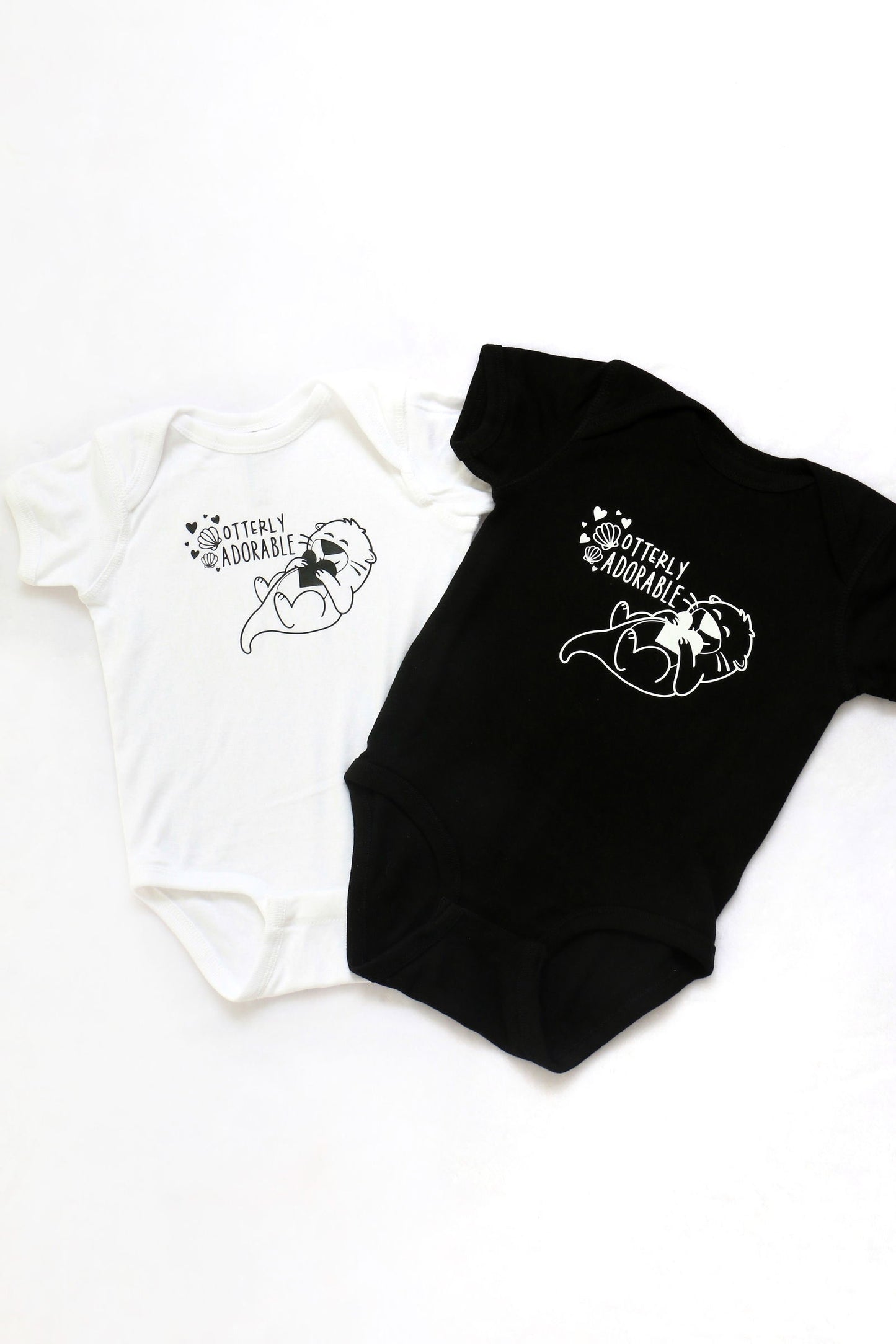 "OTTERLY ADORABLE" BABY ONESIE - www.Shopthatapp.com